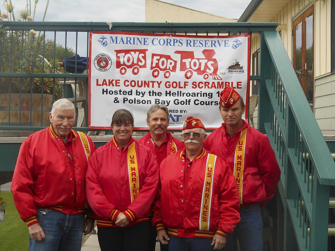 Pictured left to right are PDC Mauri Morin, Sargeant-at-Arms Lisa St. Clair, Commandant Rick Marquart, PDC Earnest Butt and Marine Michael Dennison. The group was on hand for the annual golf scramble benefitting Toys for Tots over the weekend at the Polson course. (Photo provided)