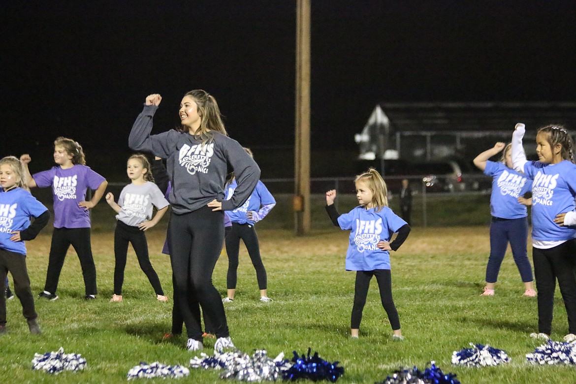 Photo by MANDI BATEMAN
The whole group took to the football field during half time last Friday.