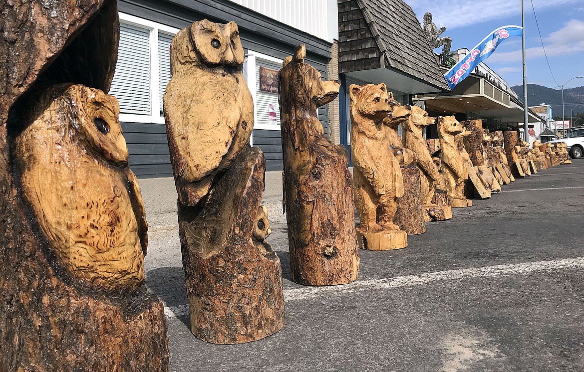 ABOVE: Chainsaw carvings line Mineral Avenue in Libby Thursday ahead of the Kootenai Country Montana Chainsaw Carving Championship being held Friday through Sunday. (John Blodgett/The Western News)