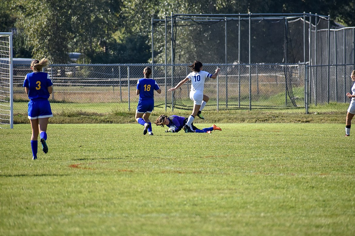 Libby sophomore goalkeeper Bethany Thomas grabs the save out from during the Lady Loggers’ 3-2 win against the Valkyries Saturday. (Ben Kibbey/The Western News)
