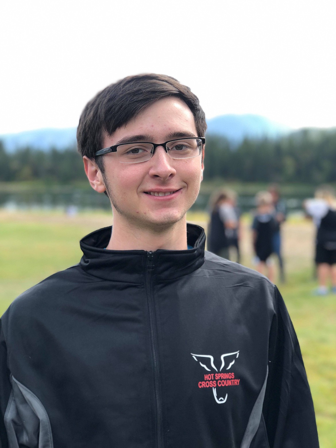 HOT SPRINGS cross country senior Josh Scrivner cheered his team on from the sidelines as he is still out with an  injury. (Erin Jusseaume/ Clark Fork Valley Press)