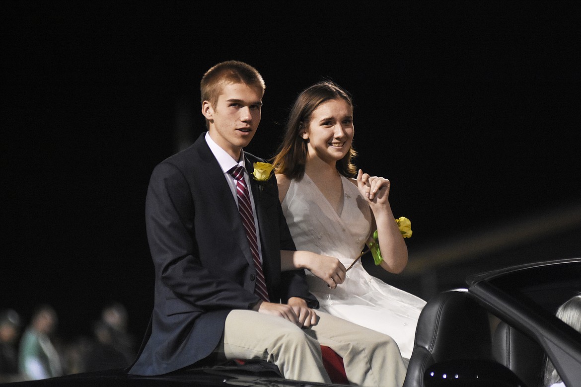 Princess Sophia Beers, representing the sophomore class, is escorted by Tyler Dunnagan during halftime of the homecoming game against Browning on Friday.