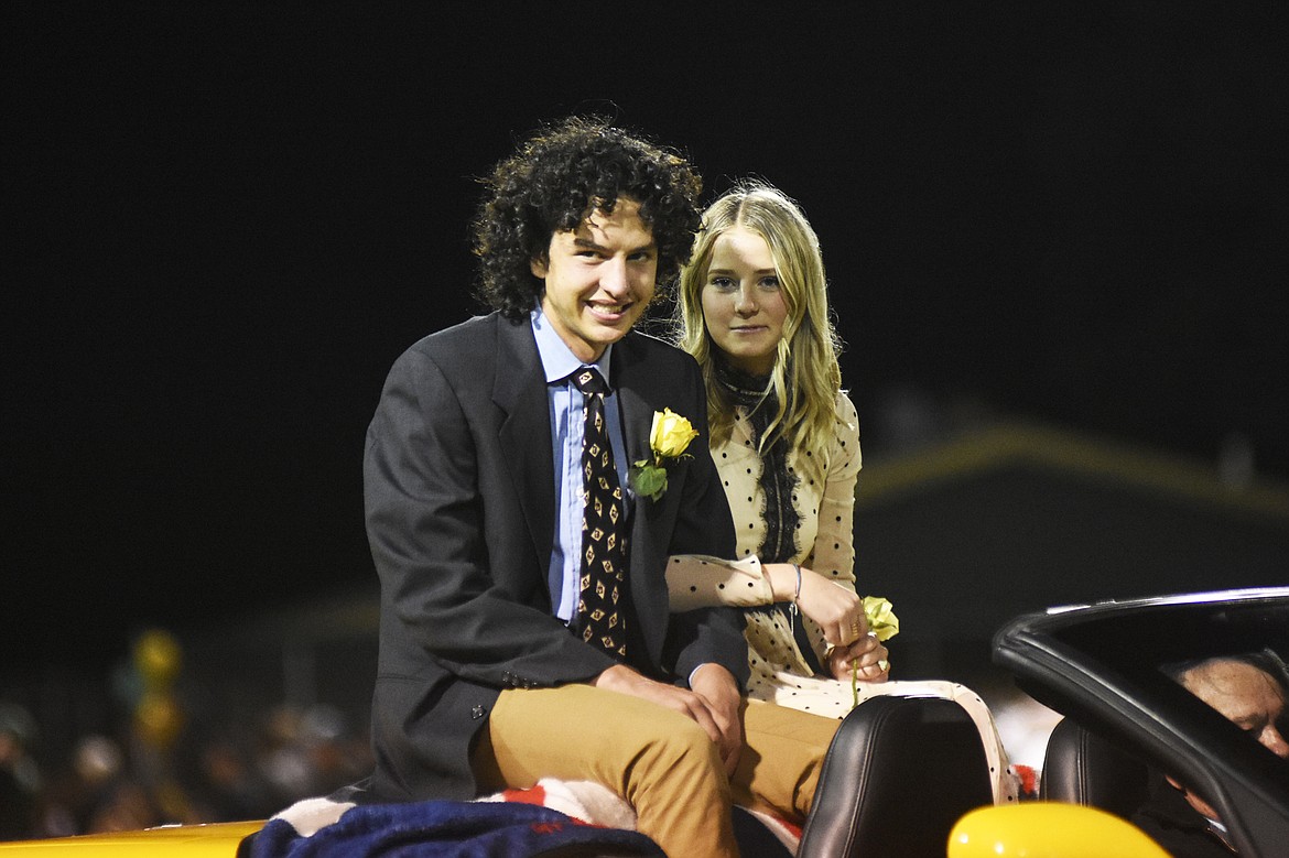 Princess Piper Dudley, representing the freshman class, is escorted by senior Ammon Koch Ford during halftime of the homecoming game against Bronwing on Friday.