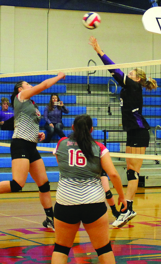 Brianna Gray of Hot Springs hammers the ball over an attempted block during the Mineral County Shootout. (Kathleen Woodford/Mineral Independent)