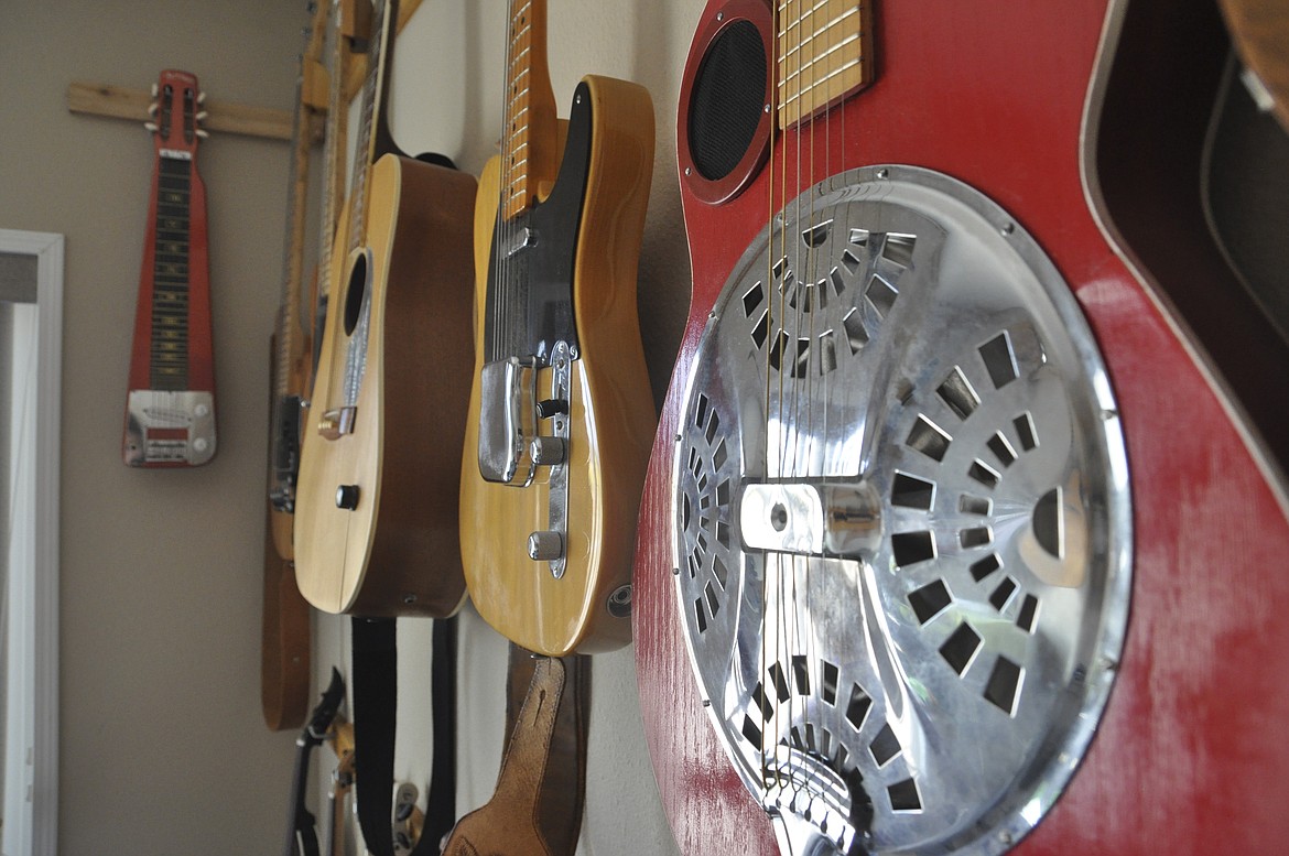 Guitars line the walls of a music room in Erma and Gil Prier&#146;s Columbia Falls home.