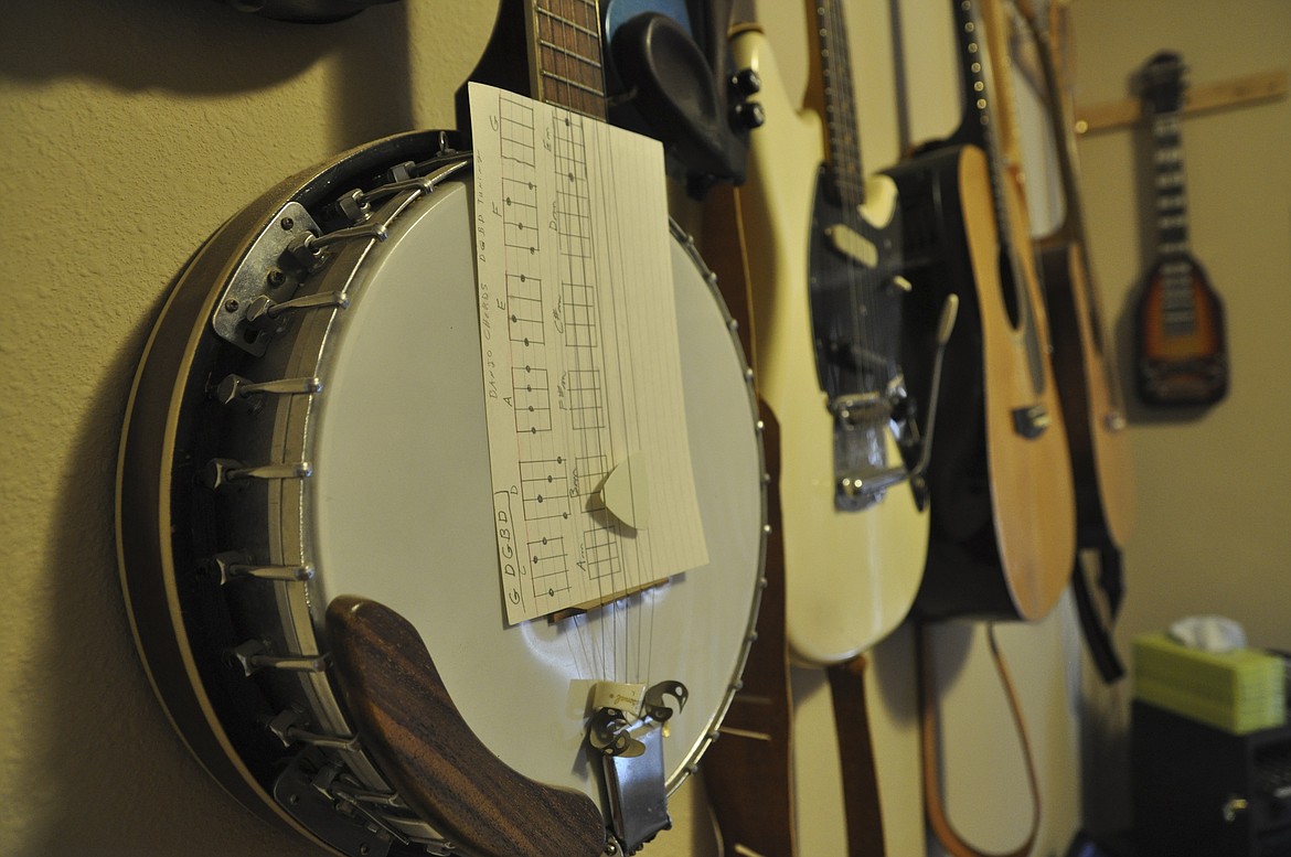 Nearly 30 instruments hang from the walls in a music room in Gil and Erma (Davis) Prier&#146;s Columbia Falls home. (Ashley Fox/Lake County Leader)