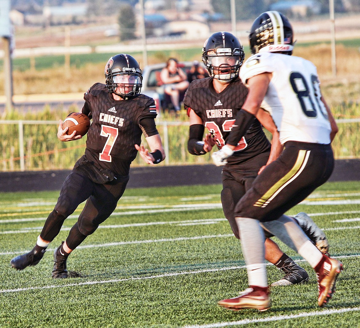 RONAN QUARTERBACK Eric Dolence (7) finds daylight in last week&#146;s game against Stevi. The Chiefs look to win their first game of the season in the Polson-Ronan game at 7 p.m. Friday night at Polson High School. (Jason Blasco/Lake County Leader)