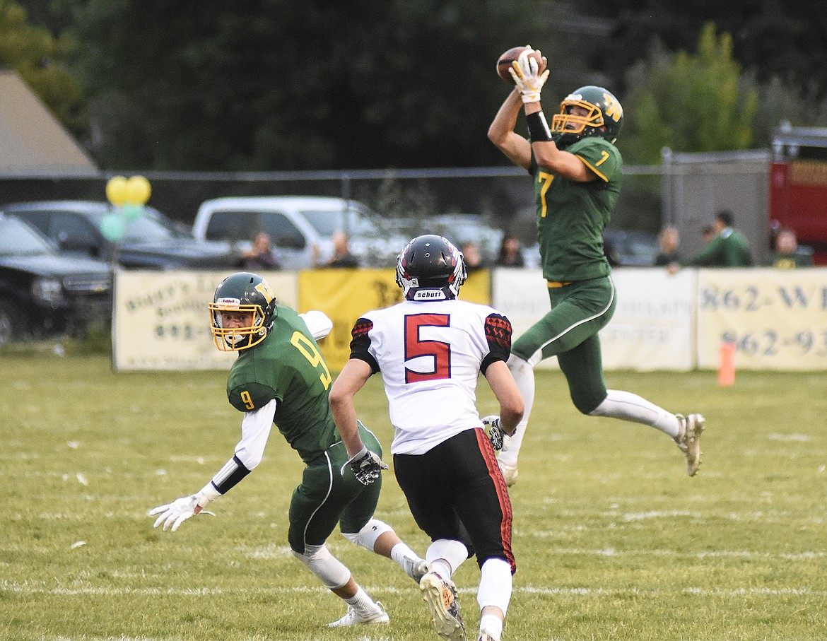 Carver Gilman makes the interception while Josh Dudley looks to block during Friday&#146;s 37-6 homecoming win over Browning. (Daniel McKay photos/Whitefish Pilot)