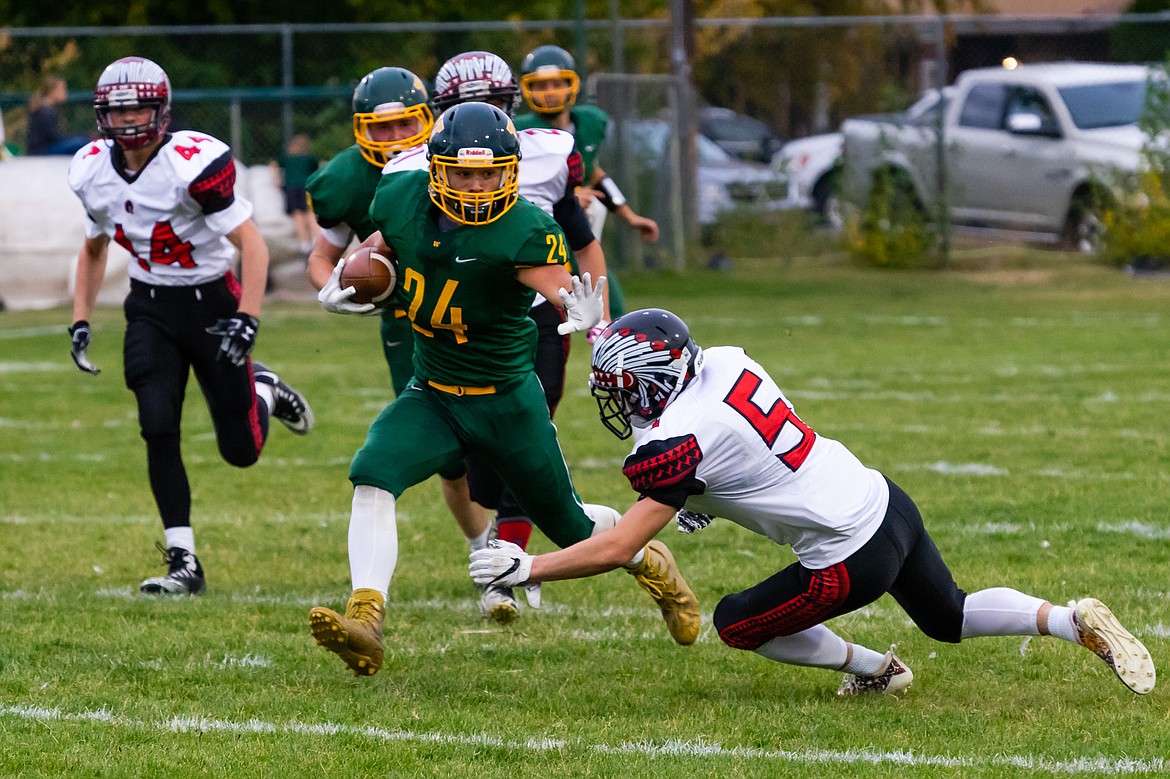 Devin Beale fights off a Browning defender during Whitefish's 37-6 homecoming win on Friday.