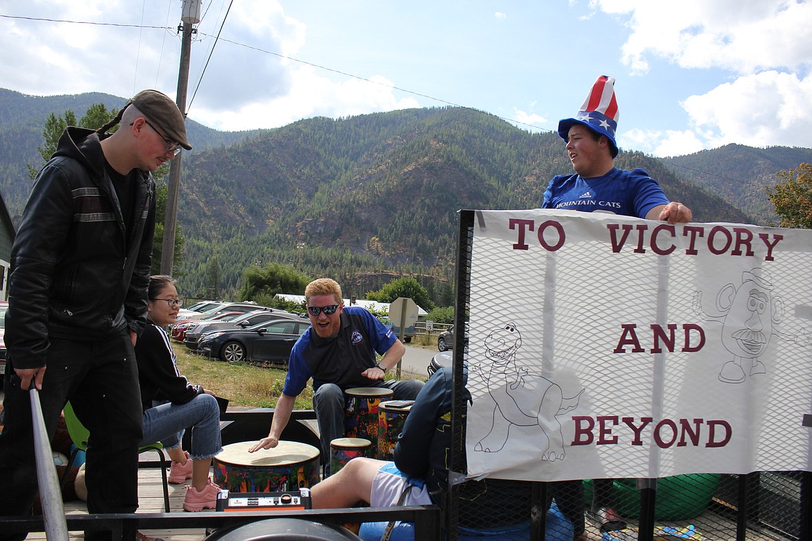 Music teacher Mike Wolfe pounds on a drum on the seniors float during Alberton&#146;s Homecoming Parade on Sept. 20.