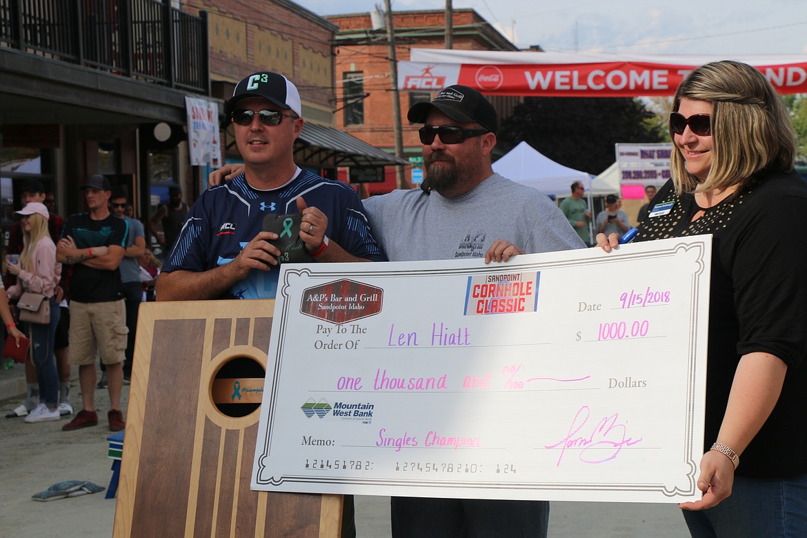 (Photo by CAROLINE LOBSINGER)
Len Hiatt, left, claimed the $1,000 winners check, alongside event organizer and 6th place finisher James Mize, and Mountain West Bank branch manager Shanna Yarbrough.