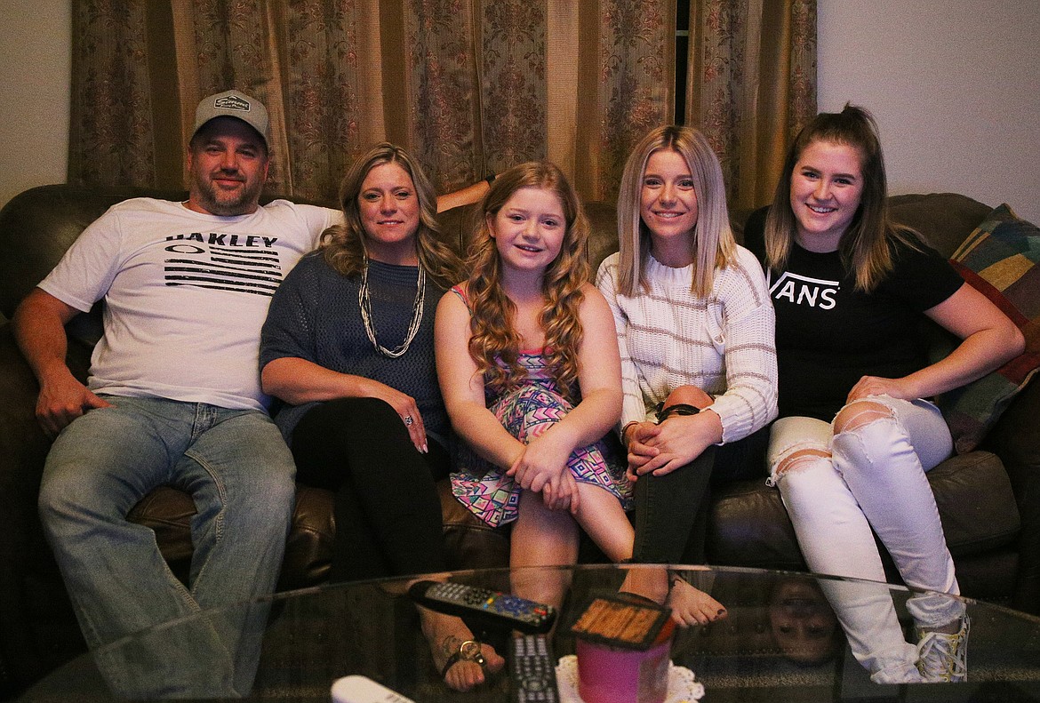 LOREN BENOIT/Press 
Danika Keyser, 12, center, is surrounded by a loving and supportive family: parents Jerod and Amber, and her sisters Rylee and Alex, far right, as she goes through treatment for chronic myelogenous leukemia.