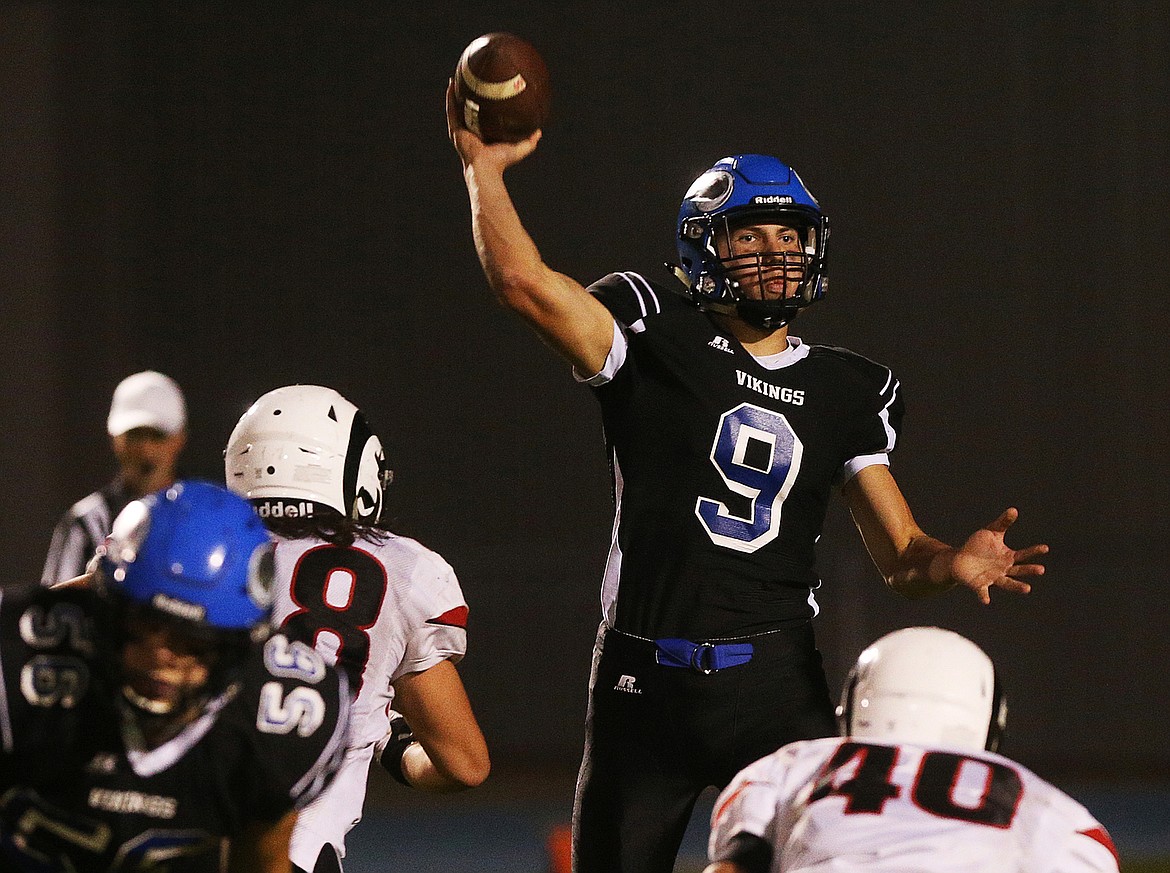 Photos: LOREN BENOIT/Press
Coeur d&#146;Alene High quarterback Kale Edwards throws the ball downfield in a Sept. 21 game against Highland. The Viking senior enjoys playing safety or linebacker just as much &#151; or more than &#151; quarterback.
