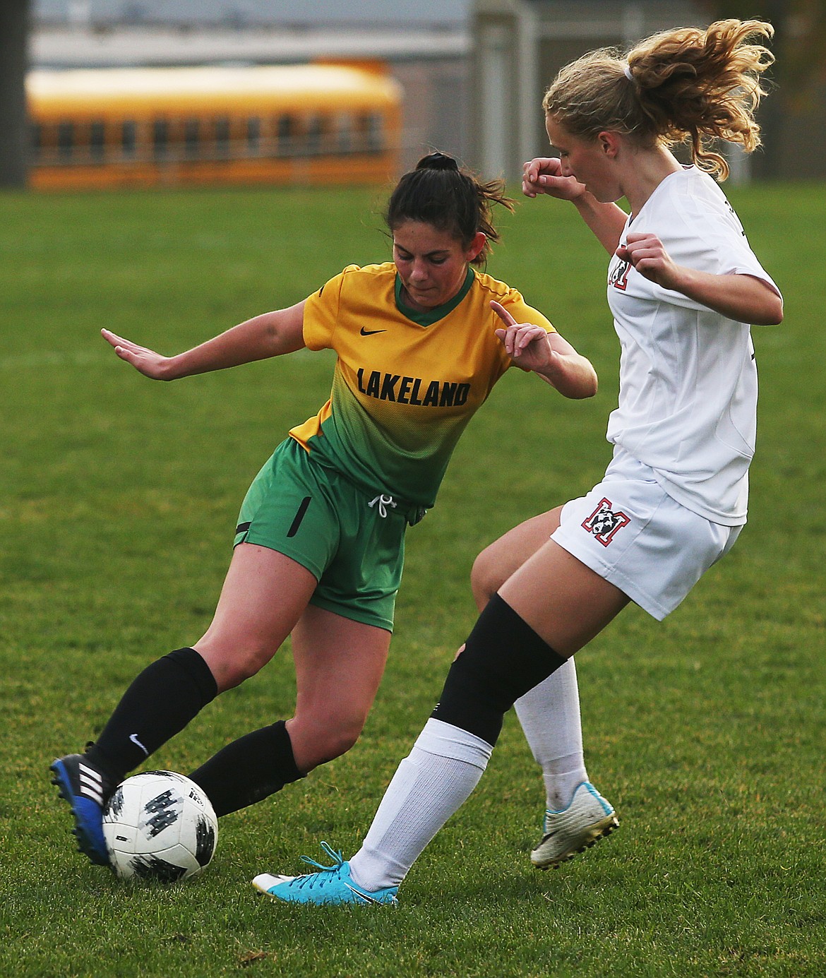 Lakeland&#146;s Makayla Higbee dribbles the ball around Moscow defender Serena Strawn in Tuesday&#146;s match at Sunrise Rotary Field in Rathdrum.