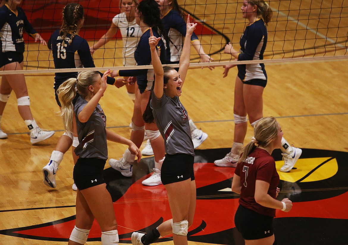 Kaitlin Hunter, center, of North Idaho College celebrates a block with her teammates during Wednesday night&#146;s match against Community Colleges of Spokane.