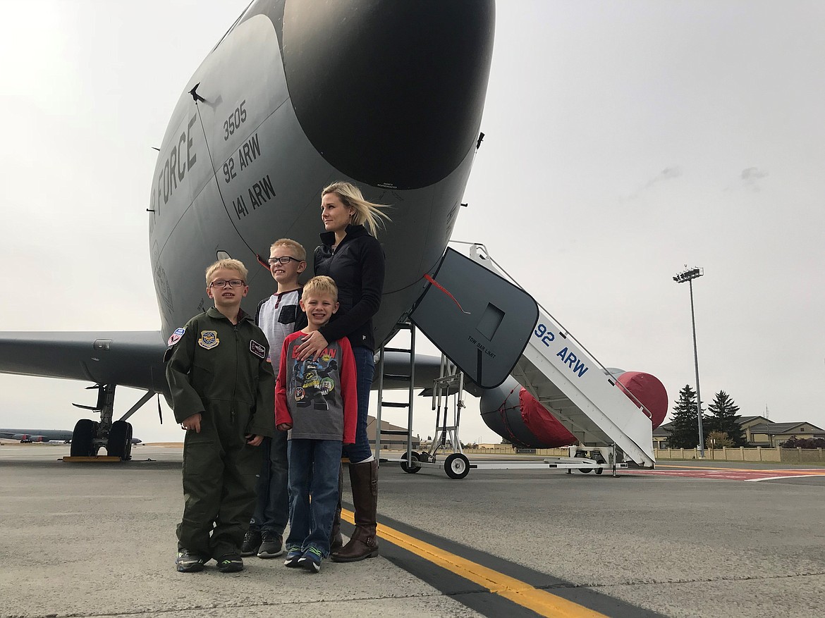 Tech. Sgt. Travis Edwards/USAF
Isaiah Watkins, left, and his brothers, Corban, 10, Ezekiel, 6 and his mother, Lisa, take a photo in front of a KC-135 Stratotanker at Fairchild Air Force Base.