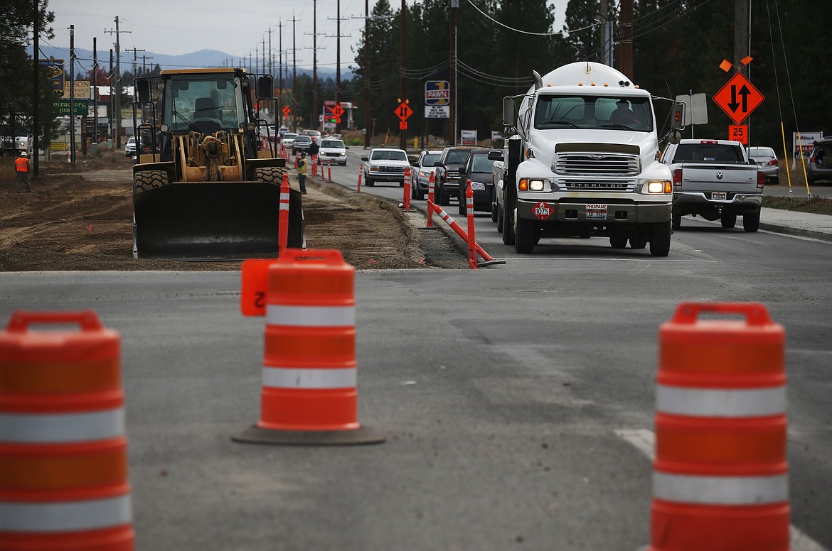 Motorists headed north negotiate a road-widening construction zone at the intersection of Prairie Avenue and Government Way on Thursday.
