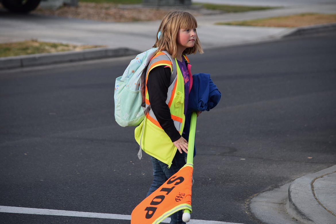 Charles H. Featherstone/Columbia Basin Herald
Crossing guard and fifth-grader Mia Bella waits for students to finish crossing the street.