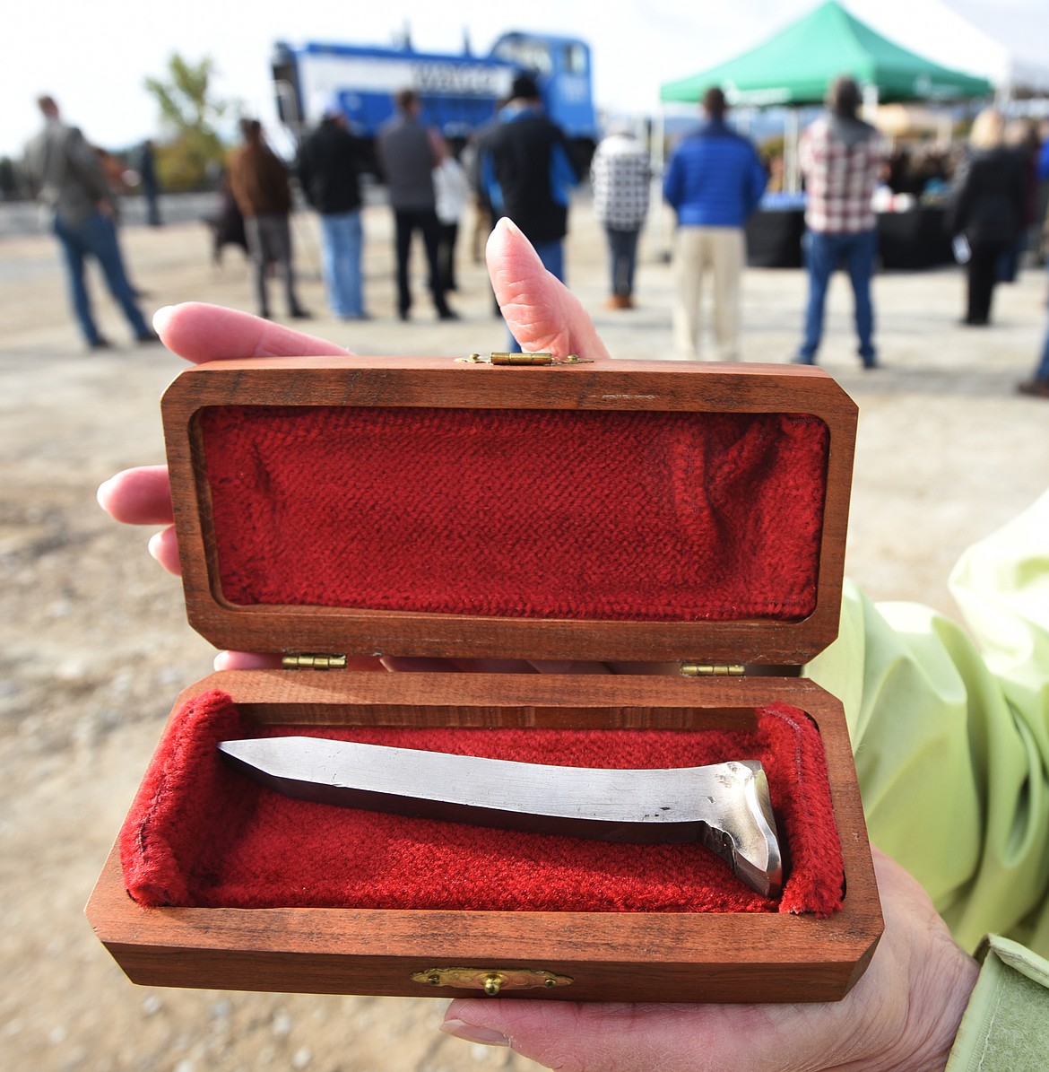 Jill Evans, executive director of the Stumptown Historical Society, holds the original silver spike that was driven at the completion of the Great Northern Railway track into Kalispell on Jan. 1, 1892. The spike was made by melting down 8 silver dollars which were donated by the &#147;ladies of Kalispell&#148; and forged by George Stanford.