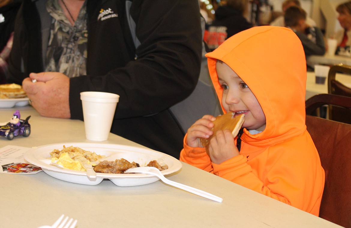 Cheryl Schweizer/Columbia Basin Herald
A customer at the Firemen&#146;s Breakfast eats his pancake his way.