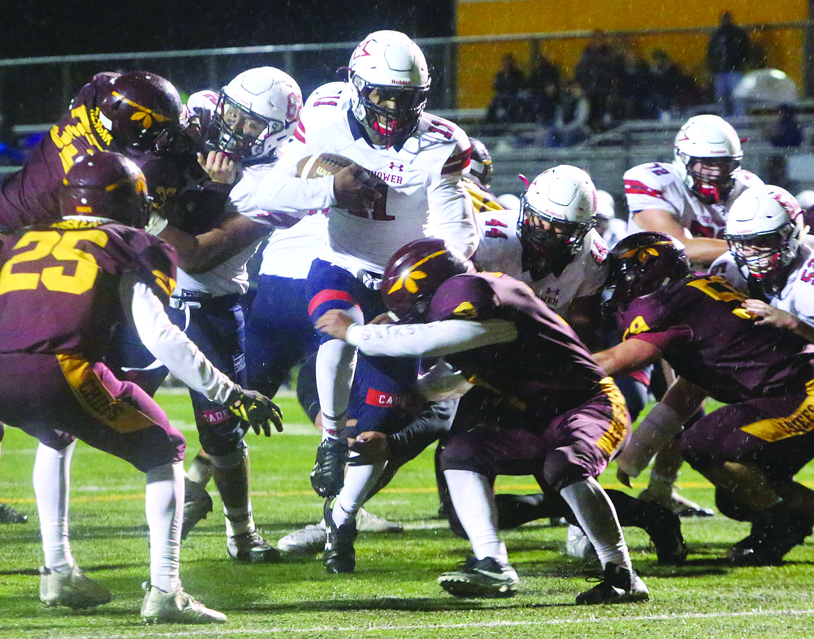 Connor Vanderweyst/Columbia Basin Herald
Eisenhower running back Demario Morgan tries to find space against the Moses Lake defense.