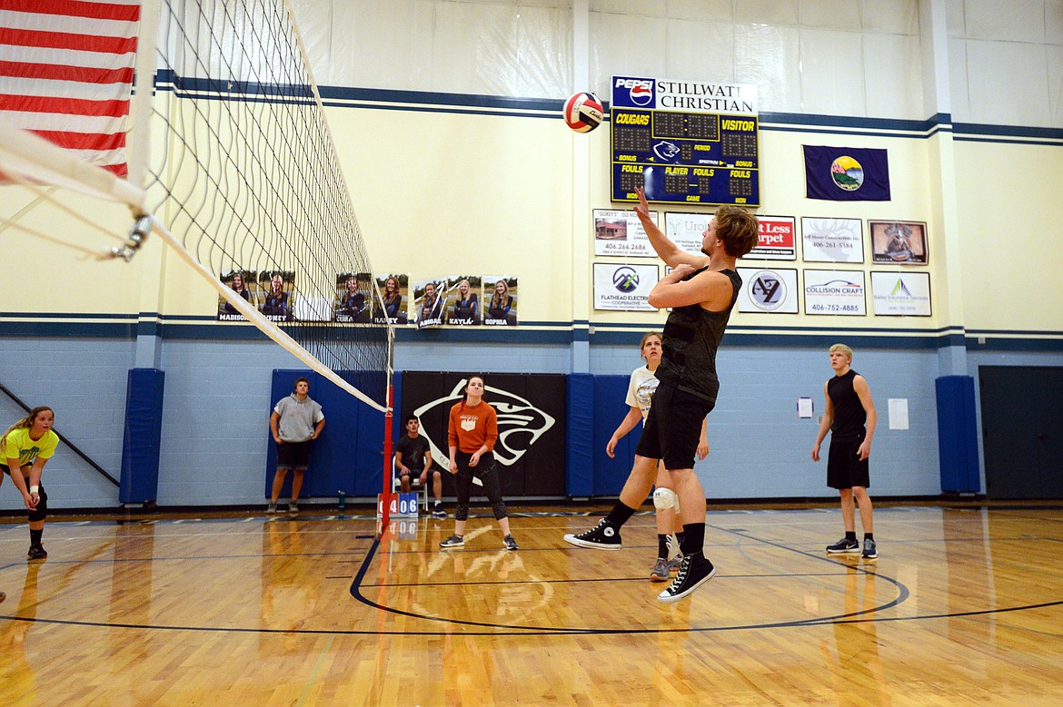 FVCC freshman Jack Couch spikes during intramural volleyball at Stillwater Christian School on Thursday evening. (Casey Kreider/Daily Inter Lake)