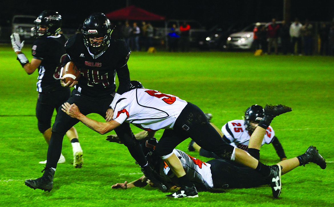 Rodney Harwood/Columbia Basin Herald
The Odessa defense held Maguire Isaak (14) to 30 yards rushing Thursday in the battle of No. 1 vs. No. 2 in Coulee City.&#160;