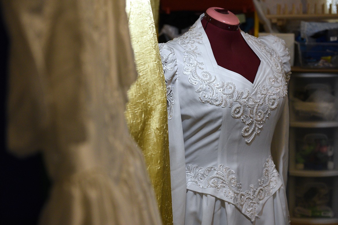 Wedding dresses are displayed in Connee Jones&#146; basement workspace in Kila on Wednesday, Oct. 3. According to Jones, each dress can be taken apart, cut and refashioned into around 10 angel gowns. (Casey Kreider/Daily Inter Lake)