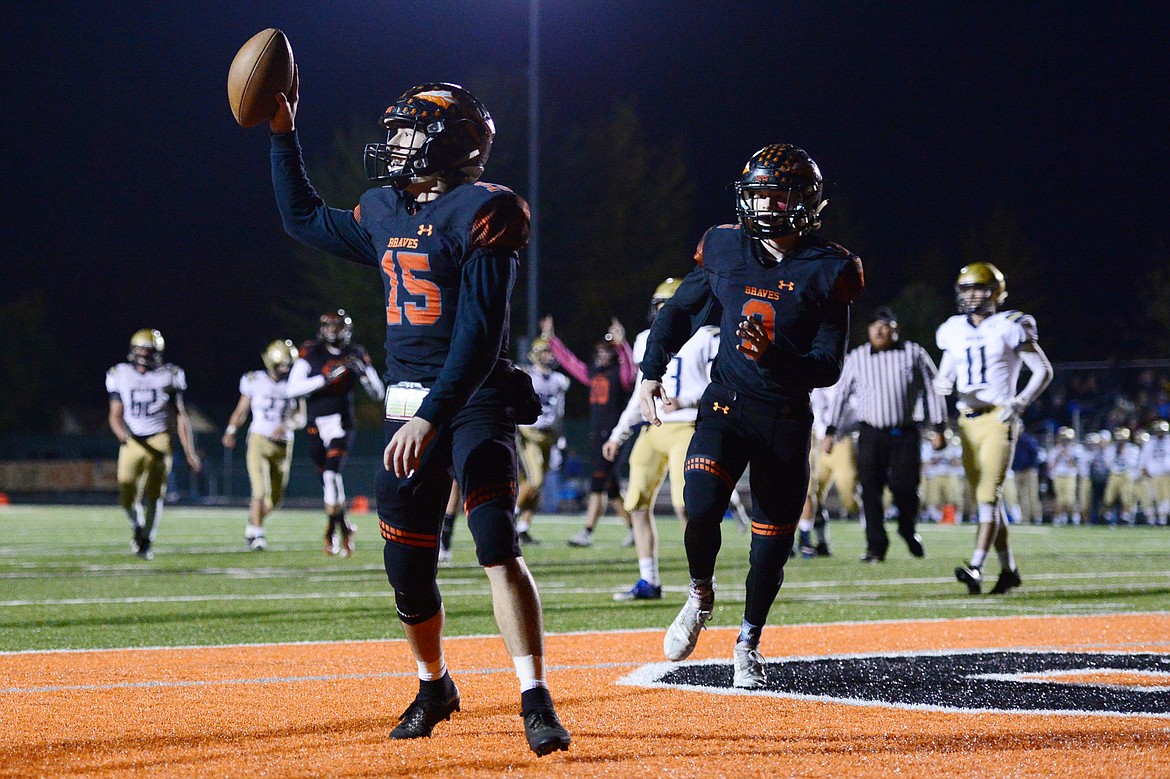 Flathead quarterback Jaden MacNeil (15) celebrates in the end zone after catching a second quarter touchdown pass from wide receiver Logan Siblerud (1) against Missoula Big Sky at Legends Stadium on Friday. (Casey Kreider/Daily Inter Lake)