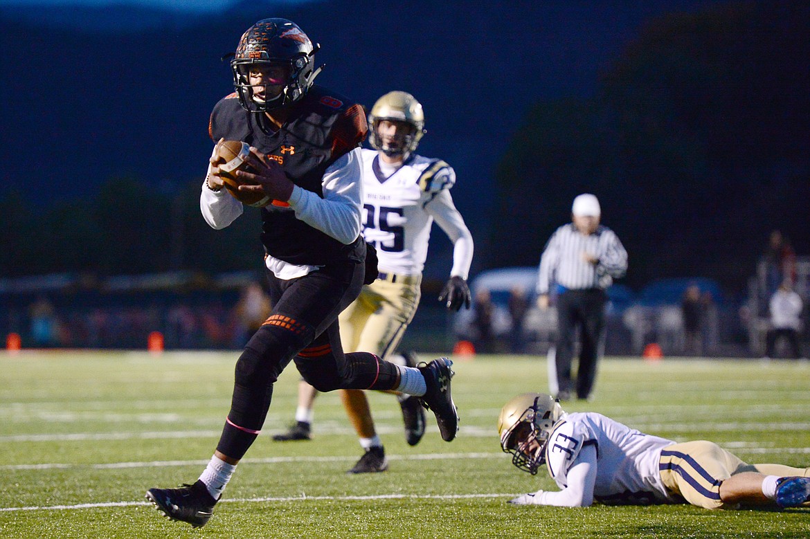 Flathead wide receiver AJ Jones heads to the end zone on a first quarter touchdown reception against Missoula Big Sky at Legends Stadium on Friday. (Casey Kreider/Daily Inter Lake)