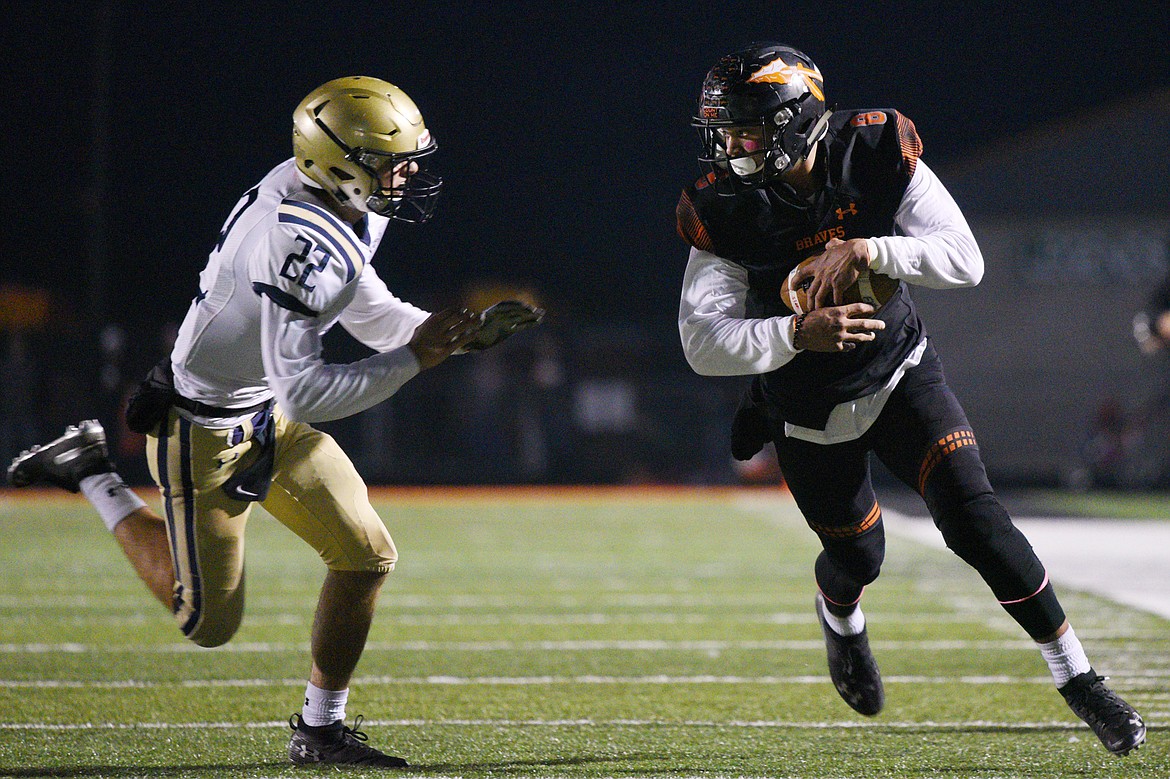 Flathead wide receiver AJ Jones (8) runs after a reception with Missoula Big Sky defender Andrew Gardanier pursuing (22) at Legends Stadium on Friday. (Casey Kreider/Daily Inter Lake)