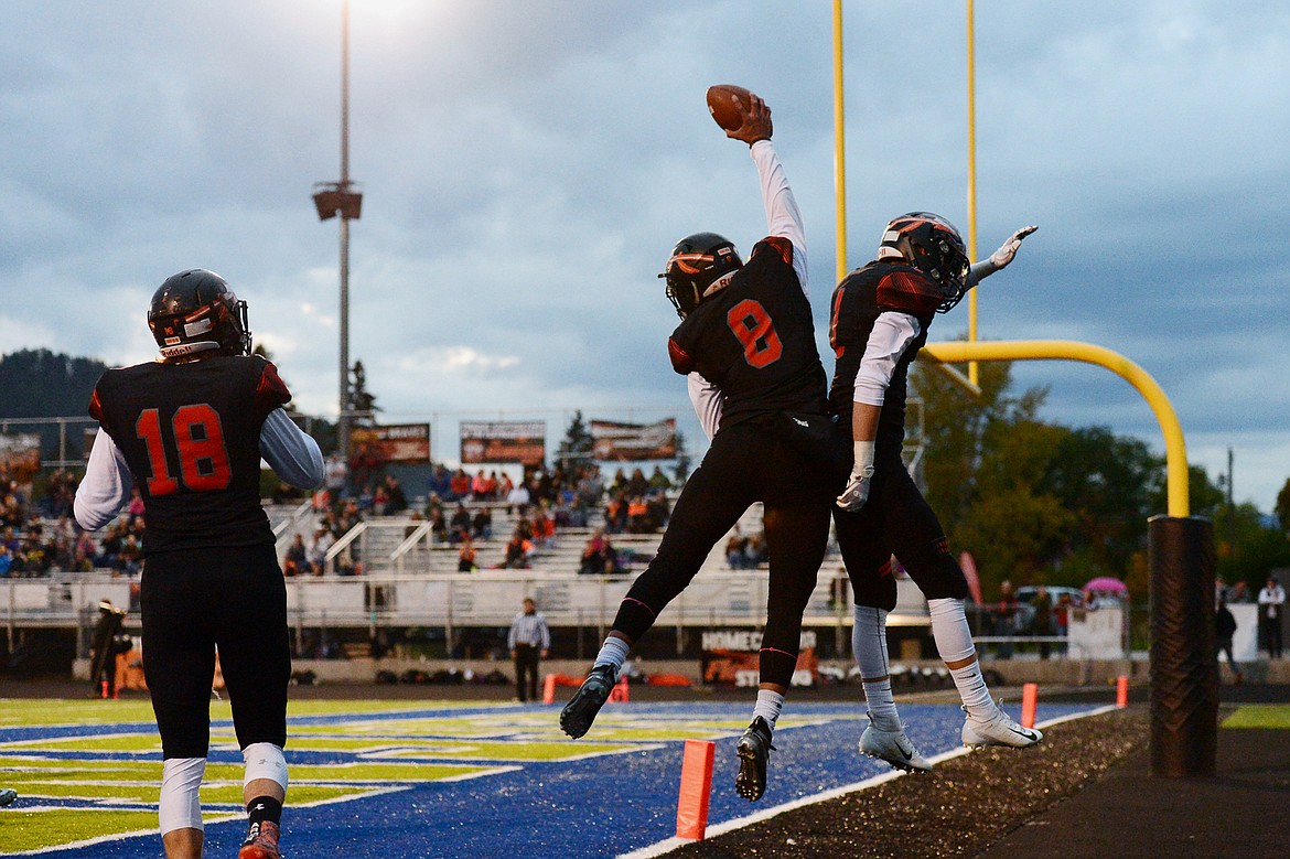 Flathead wide receiver AJ Jones (8) celebrates with teammate Logan Siblerud (1) after Jones' first-quarter touchdown reception against Missoula Big Sky at Legends Stadium on Friday. (Casey Kreider/Daily Inter Lake)