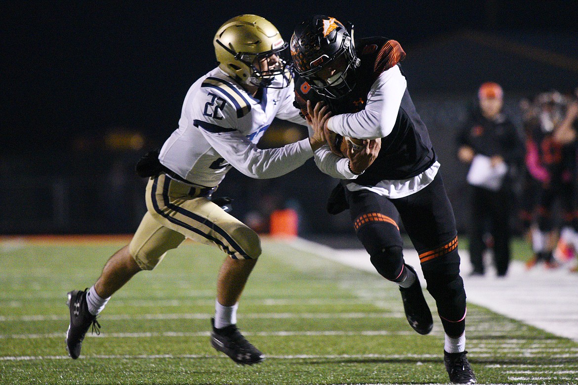 Flathead wide receiver AJ Jones (8) runs after a reception with Missoula Big Sky defender Andrew Gardanier pursuing (22) at Legends Stadium on Friday. (Casey Kreider/Daily Inter Lake)