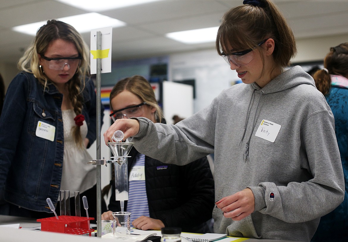 LOREN BENOIT/Press
Venture High School student Trinity Houk pours a contaminated sample into a small measuring cup during a hands-on water filtration activity Tuesday morning at University of Idaho&#146;s 10th annual Women in Math and Science event.
