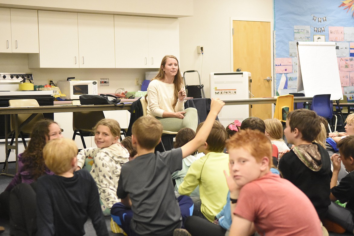 Cara Julian, Lead Architect from L&#146;Heureux, Page and Werner, fields questions from third graders at Muldown Elementary School before a tour of the new Muldown&#146;s construction site last week. The tour came as part of Construction Week, hosted by the Montana Contractors Association and the Office of Public Instruction.