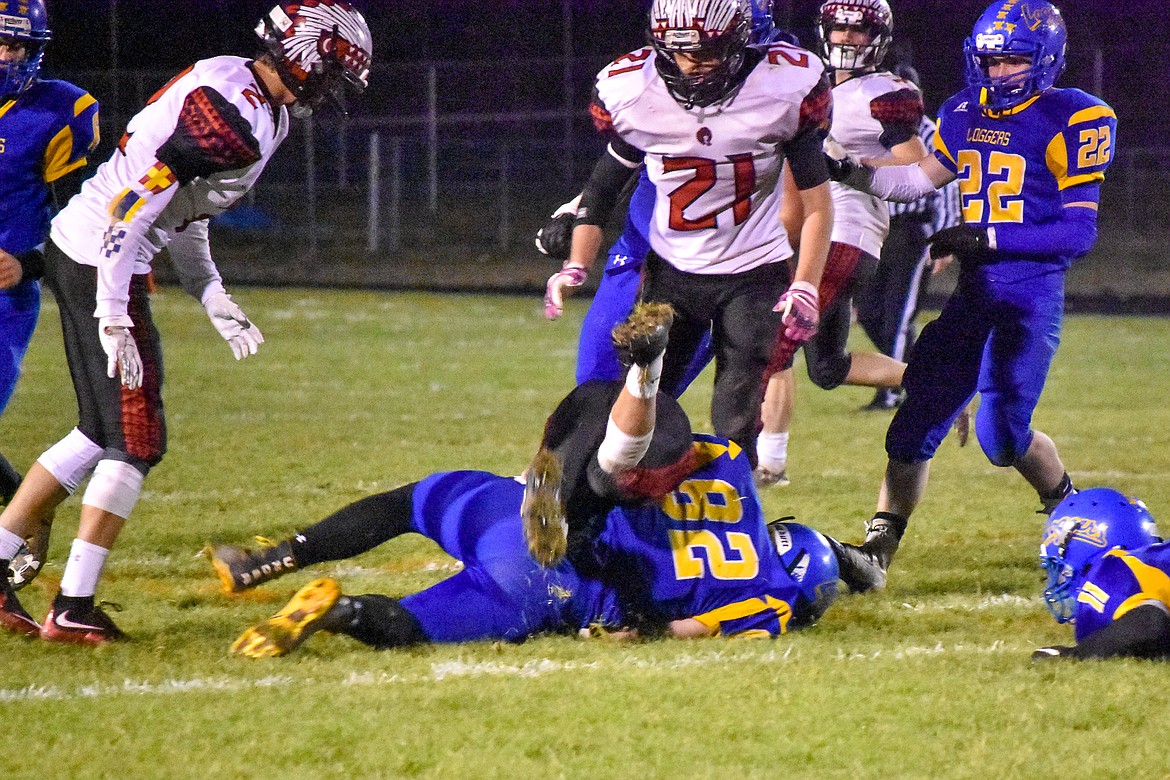 After a 12 yard gain early in the third quarter, Libby junior defensive end Cayman Lee brings down Browning running back Trevon Fisher during the Loggers&#146; 42-14 homecoming win over the Indians Friday. (Ben Kibbey/The Western News)