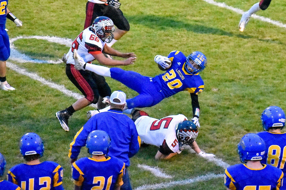 Libby sophomore running back Dawson Young goes down after gaining 11 yards early n the first quarter of the Loggers' 42-14 homecoming win over Browning Friday. (Ben Kibbey/The Western News)