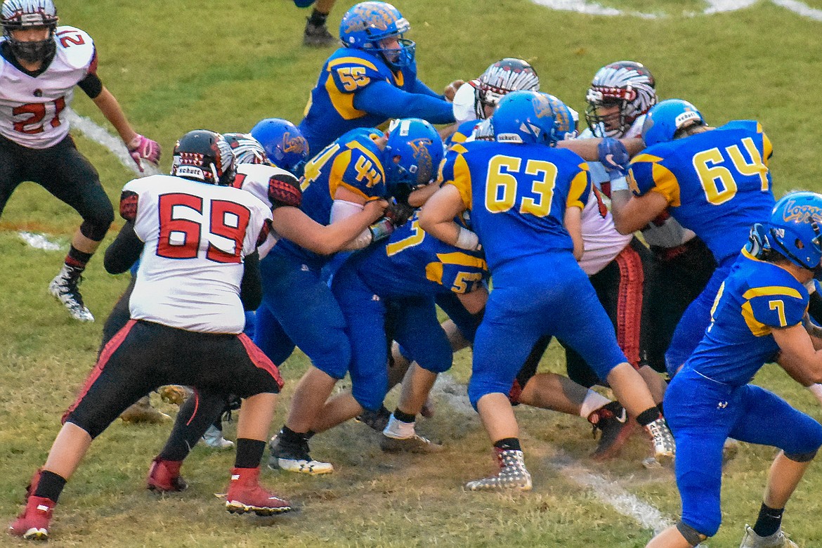 Libby freshman fullback Aydan Williamson carries the ball for a gain in the opening minutes of Libby's 42-14 homecoming win over Browning Friday night. (Ben Kibbey/The Western News)