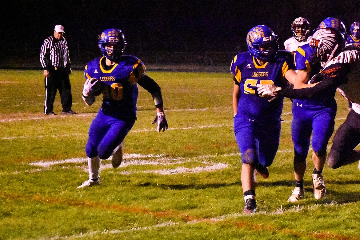 With the offensive line clearing the way, Libby sophomore running back Dawson Young heads for the end zone midway into the third quarter to retake the lead for Libby, 20-14, during the Loggers&#146; 42-14 win over Browning Friday. (Ben Kibbey/The Western News)