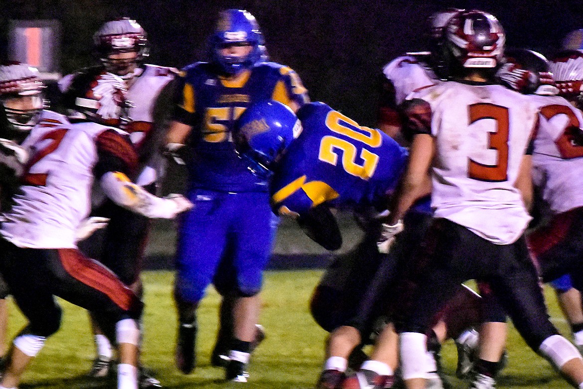 Midway through the fourth quarter, Libby sophomore running back Dawson Young launches into the end zone to make the score 34-14 during the Loggers&#146; 42-14 homecoming win over Browning Friday. (Ben Kibbey/The Western News)