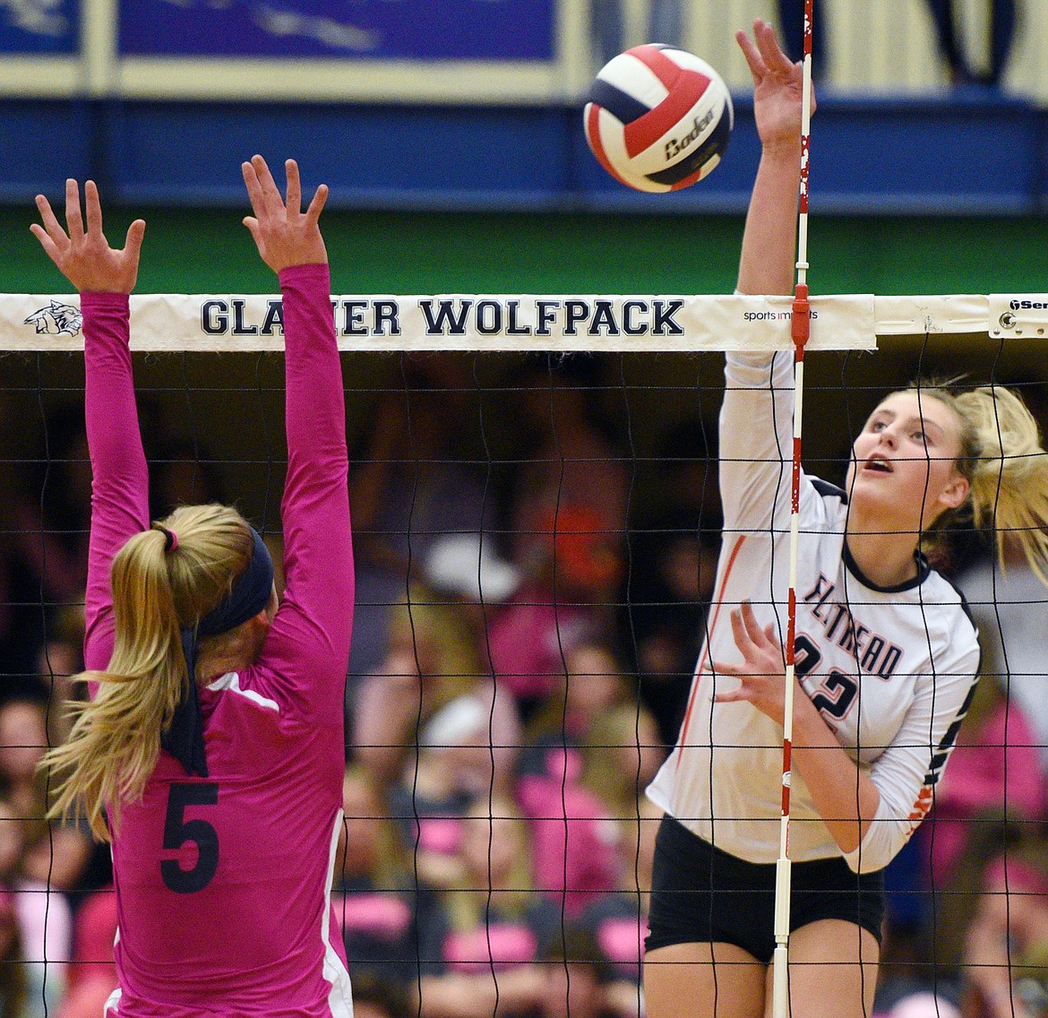 Flathead's Julia Burden (22) goes for a kill against Glacier's Kaylee Fritz (5) during crosstown volleyball at Glacier High School on Thursday. (Casey Kreider/Daily Inter Lake)