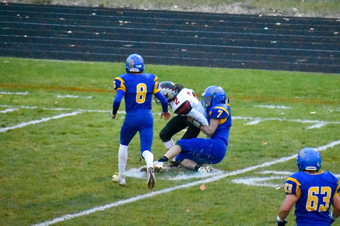 Libby sophomore Dave Patterson brings down Browning's Trevon Fisher after Fisher made a 60 yard gain on the first Indian possession, during the first quarter of the Logger's 42-14 homecoming win over Browning Friday. (Ben Kibbey/The Western News)