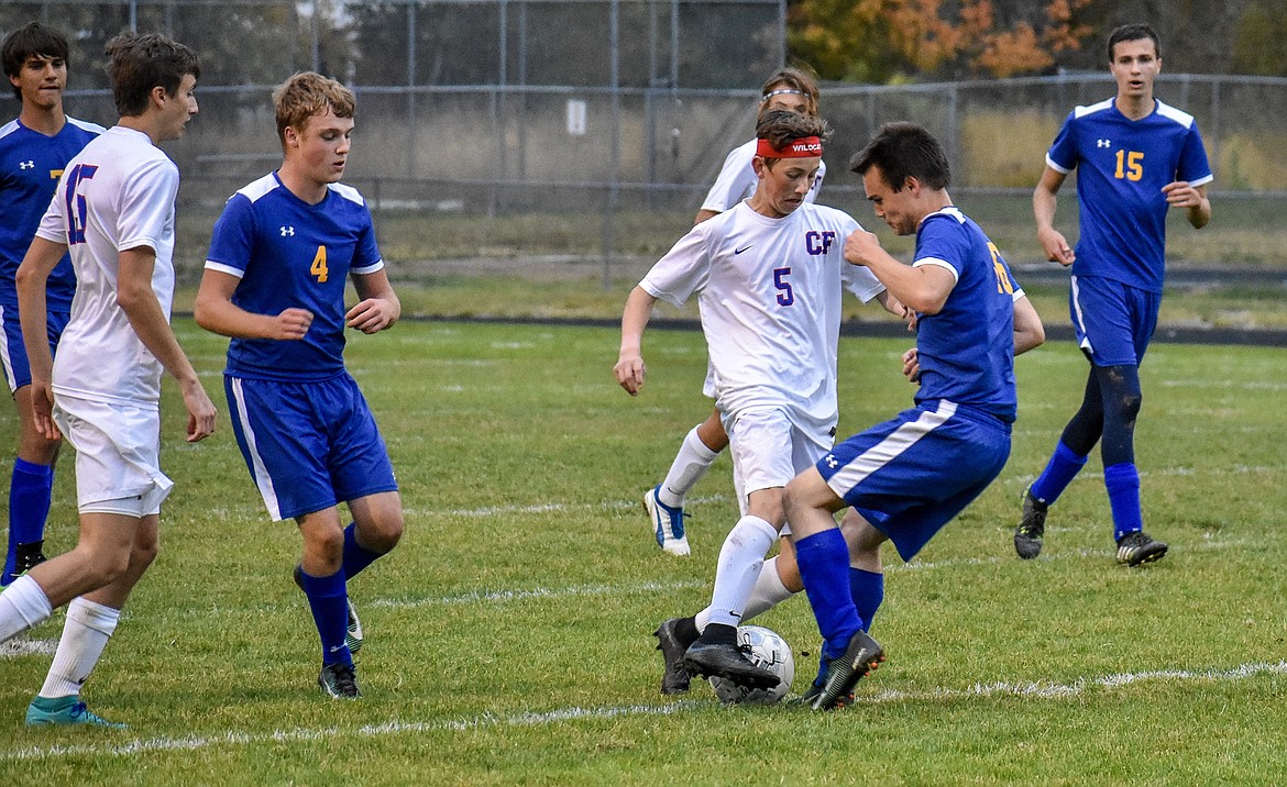 Libby senior Ethan Neff moves in for a steal off of the Wildcat&#146;s Jason Albin Tuesday during Libby&#146;s 1-0 loss to Columbia Falls. (Ben Kibbey/The Western News)