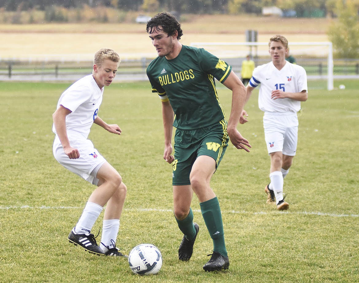 Sam Menicke gets by Bigfork defenders during last week's 8-1 win at home.