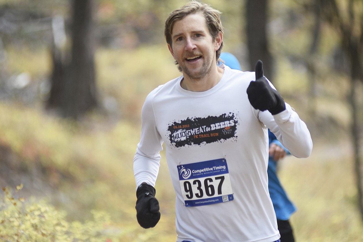 Andy Craig gives a thumbs up during the start of the 10K race during the Whitefish Trail Legacy Run Sunday morning. (Heidi Desch/Whitefish Pilot)