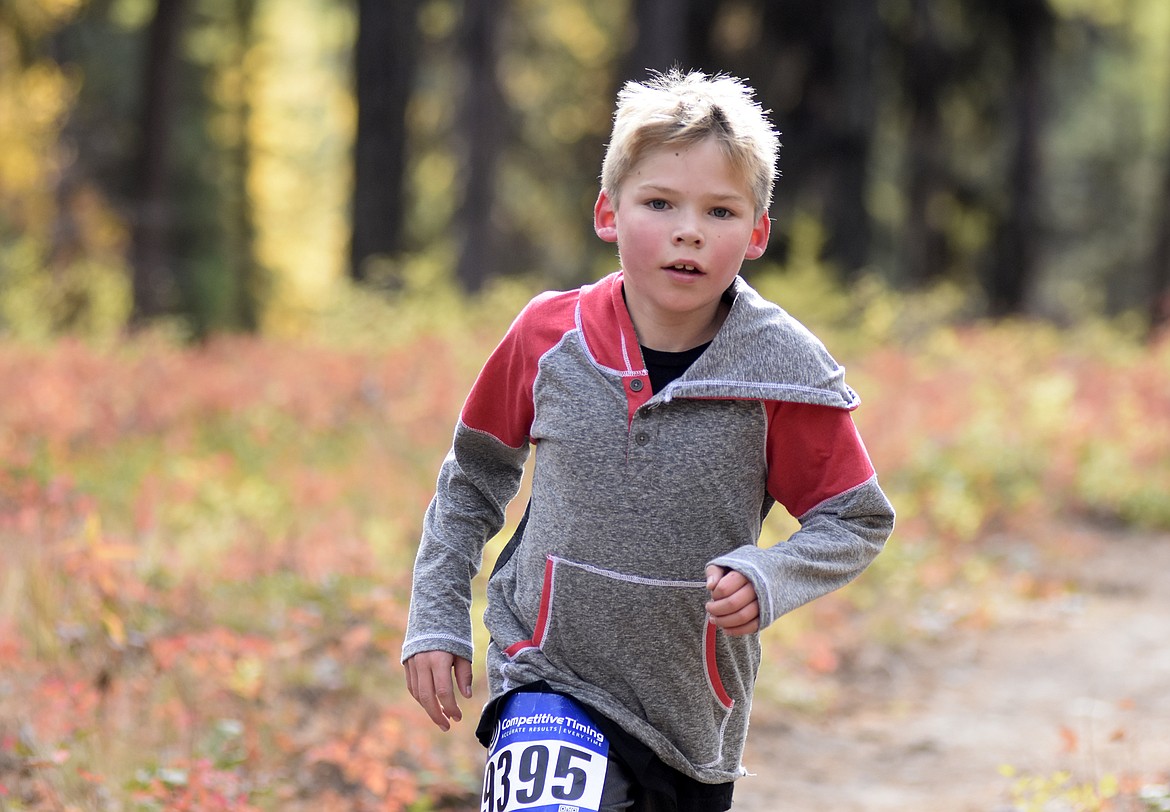 Maxwell Brown, 9, finished first for male runners in the 2-mile fun run on the Whitefish Trail Sunday morning during the Whitefish Trail Legacy Run. (Heidi Desch/Whitefish Pilot)