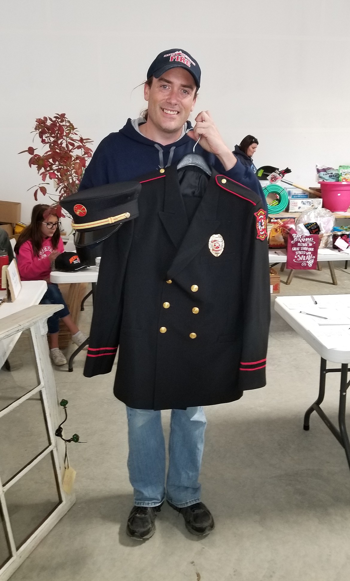 Photo by MANDI BATEMANHall Mountain Volunteer Firefighter Wally Nyberg revealed the new uniformes for the Boundary County Fire Service Honor Guard.