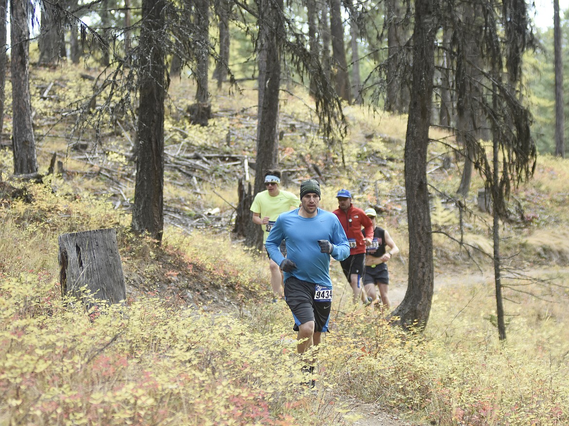 Ryan Senn leads a group of runners in the 10K race during the Whitefish Trail Legacy Run Sunday morning. (Heidi Desch/Whitefish Pilot)