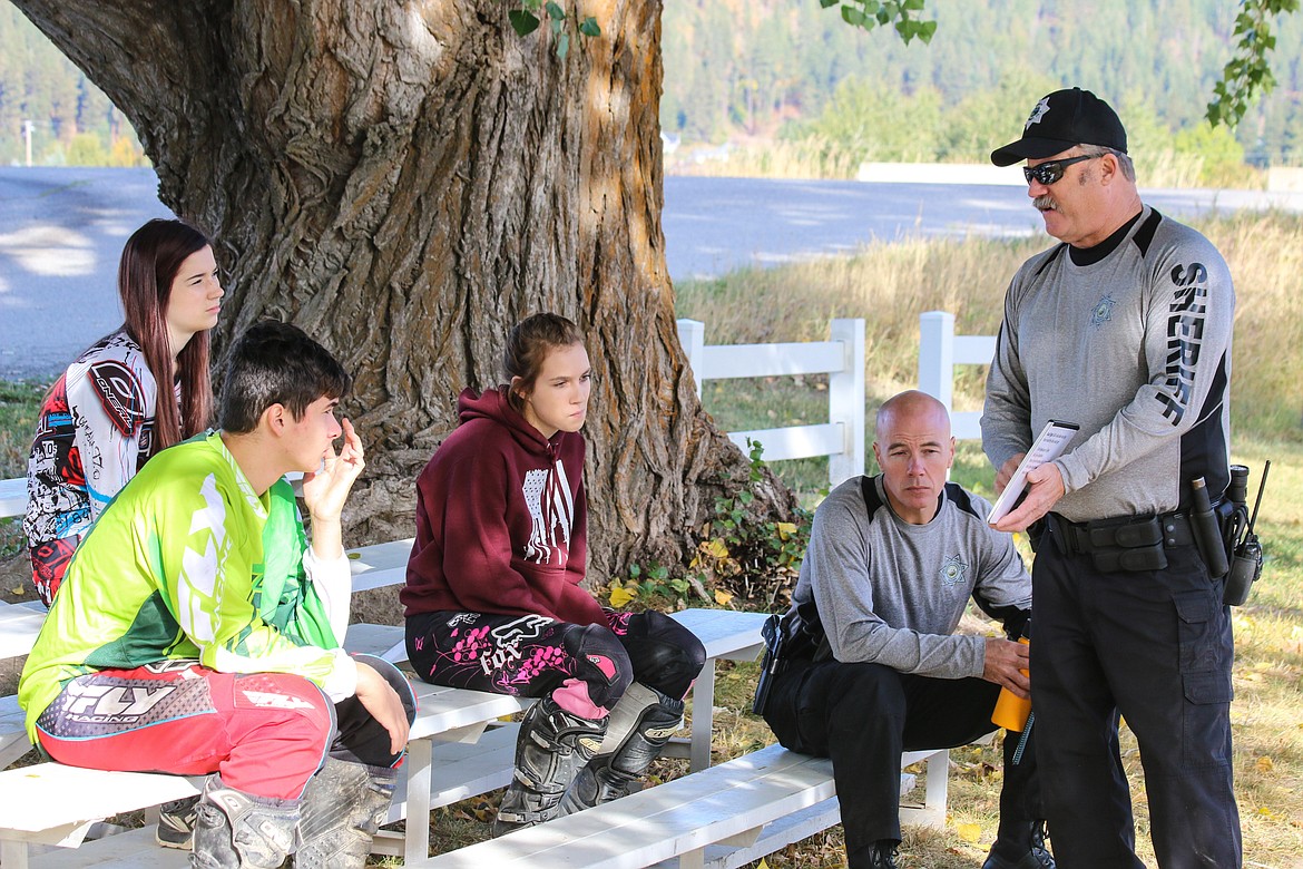 Photo by MANDI BATEMANThe students learn safety and rules from Boundary County Reserve Deputy Steve Ussher during the OHV class.