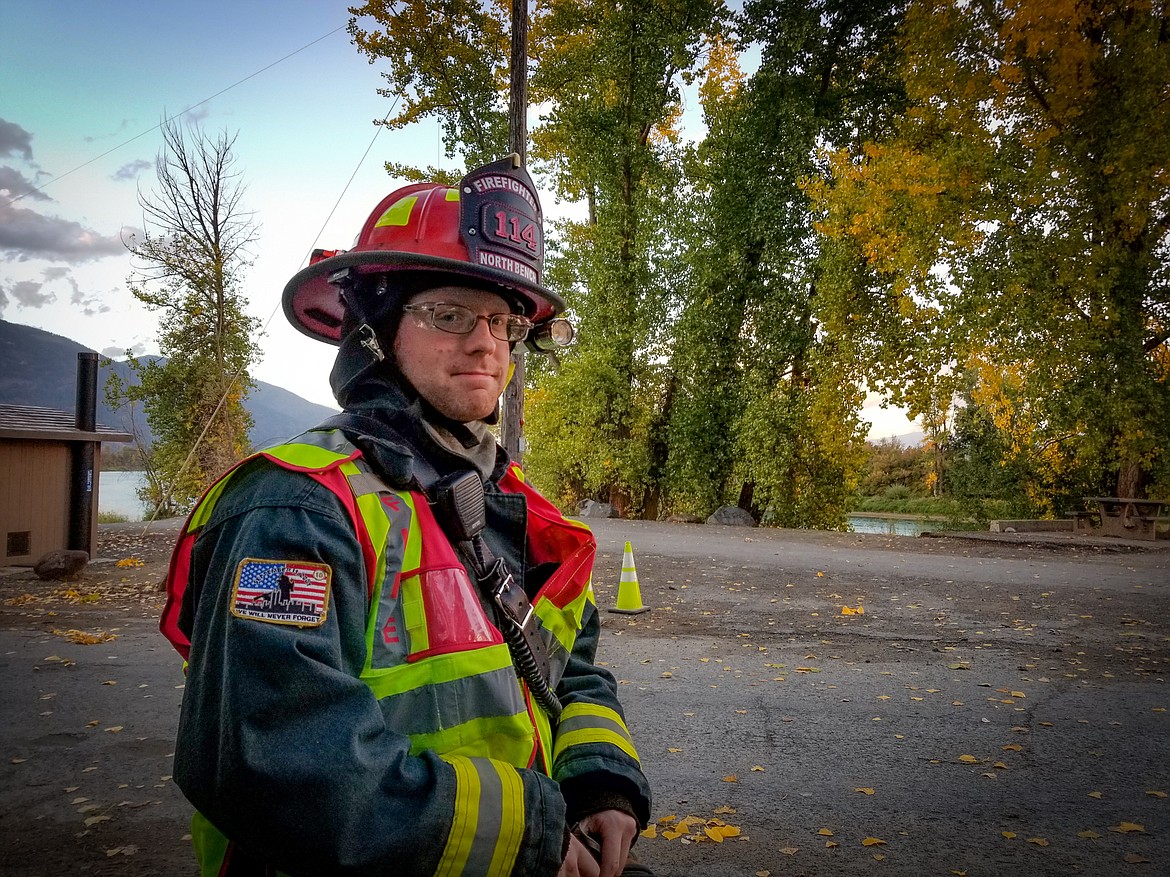 Photo by MANDI BATEMAN
North Bench Firefighter Granite Allinger on scene at a downed power line on Tuesday evening.